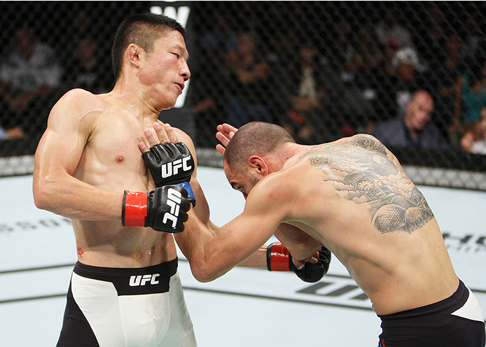 SAITAMA, JAPAN - SEPTEMBER 27: Kyoji Horiguchi of Japan punches Chico Camus of the United States of America in their flyweight bout during the UFC event at the Saitama Super Arena on September 27, 2015 in Saitama, Japan. (Photo by Mitch Viquez/Zuffa LLC/Z