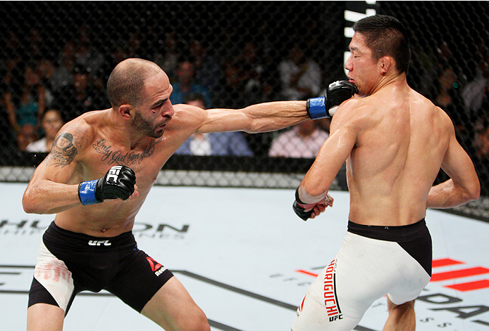 SAITAMA, JAPAN - SEPTEMBER 27: Chico Camus of the United States of America punches Kyoji Horiguchi of Japan in their flyweight bout during the UFC event at the Saitama Super Arena on September 27, 2015 in Saitama, Japan. (Photo by Mitch Viquez/Zuffa LLC/