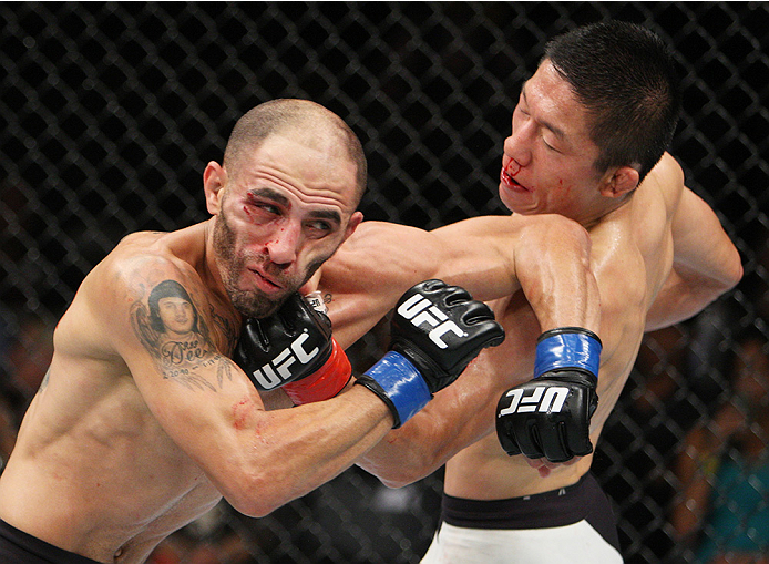SAITAMA, JAPAN - SEPTEMBER 27: Kyoji Horiguchi of Japan punches Chico Camus of the United States of America in their flyweight bout during the UFC event at the Saitama Super Arena on September 27, 2015 in Saitama, Japan. (Photo by Mitch Viquez/Zuffa LLC/Z
