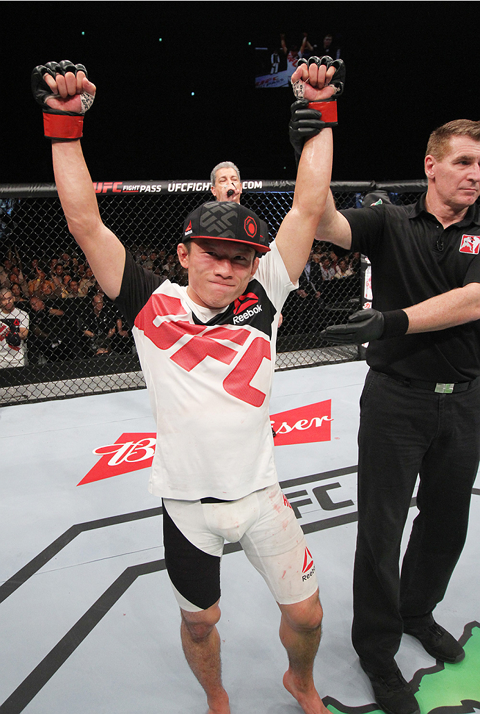 SAITAMA, JAPAN - SEPTEMBER 27: Kyoji Horiguchi of Japan celebrates his win over Chico Camus of the United States of America in their flyweight bout during the UFC event at the Saitama Super Arena on September 27, 2015 in Saitama, Japan. (Photo by Mitch V