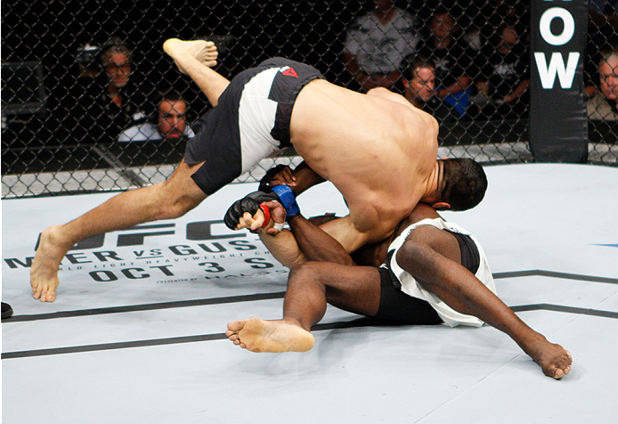 SAITAMA, JAPAN - SEPTEMBER 27: (From L to R) Gegard Mousaasi of Iran and Uriah Hall of Jamaica scramble for control in their middleweight bout during the UFC event at the Saitama Super Arena on September 27, 2015 in Saitama, Japan. (Photo by Mitch Viquez/