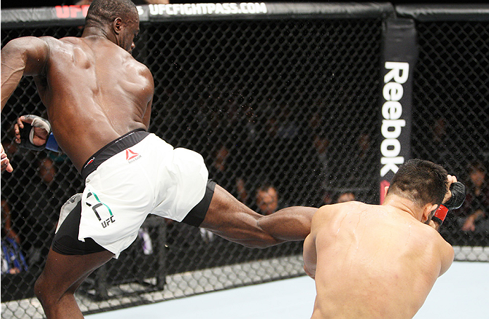 SAITAMA, JAPAN - SEPTEMBER 27: Uriah Hall of Jamaica lands a back kick to drop his opponent, Gegard Mousaasi of Iran in their middleweight bout during the UFC event at the Saitama Super Arena on September 27, 2015 in Saitama, Japan. (Photo by Mitch Viquez