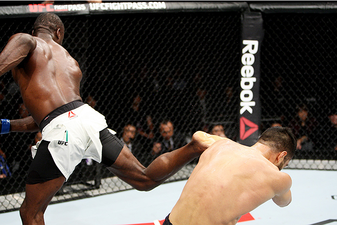 SAITAMA, JAPAN - SEPTEMBER 27: Uriah Hall of Jamaica lands a back kick to drop his opponent, Gegard Mousaasi of Iran in their middleweight bout during the UFC event at the Saitama Super Arena on September 27, 2015 in Saitama, Japan. (Photo by Mitch Viquez