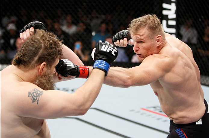 SAITAMA, JAPAN - SEPTEMBER 27: Josh Barnett of the United States of America throws a punch at Roy Nelson of the United States of America in their heavyweight bout during the UFC event at the Saitama Super Arena on September 27, 2015 in Saitama, Japan. (Ph
