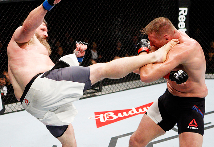 SAITAMA, JAPAN - SEPTEMBER 27: Roy Nelson of the United States of America kicks Josh Barnett of the United States of America in their heavyweight bout during the UFC event at the Saitama Super Arena on September 27, 2015 in Saitama, Japan. (Photo by Mitch