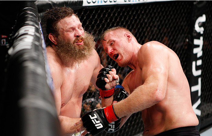 SAITAMA, JAPAN - SEPTEMBER 27: Josh Barnett of the United States of America punches Roy Nelson of the United States of America in their heavyweight bout during the UFC event at the Saitama Super Arena on September 27, 2015 in Saitama, Japan. (Photo by Mit