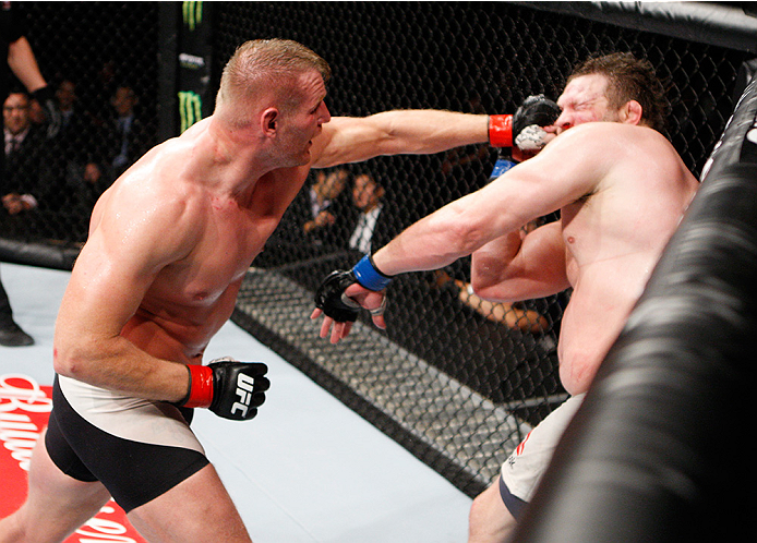 SAITAMA, JAPAN - SEPTEMBER 27: Josh Barnett of the United States of America punches Roy Nelson of the United States of America in their heavyweight bout during the UFC event at the Saitama Super Arena on September 27, 2015 in Saitama, Japan. (Photo by Mi