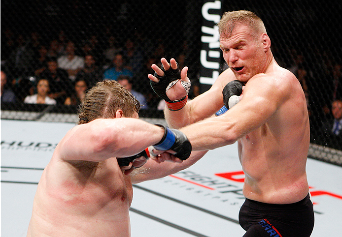 SAITAMA, JAPAN - SEPTEMBER 27: Roy Nelson of the United States of America punches Josh Barnett of the United States of America in their heavyweight bout during the UFC event at the Saitama Super Arena on September 27, 2015 in Saitama, Japan. (Photo by Mit