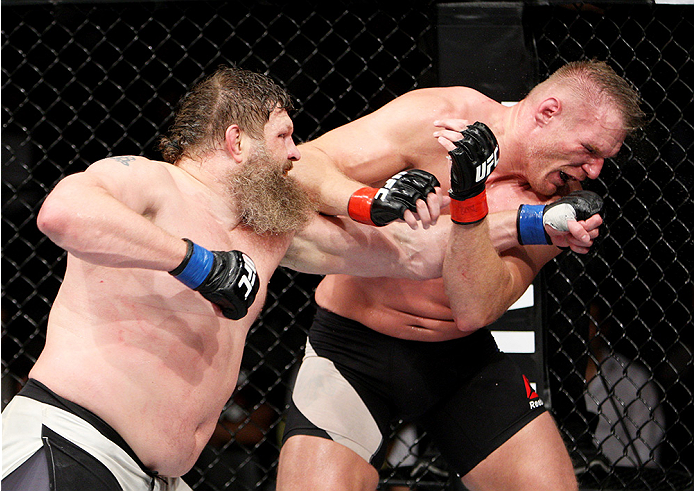 SAITAMA, JAPAN - SEPTEMBER 27: Roy Nelson of the United States of America punches Josh Barnett of the United States of America in their heavyweight bout during the UFC event at the Saitama Super Arena on September 27, 2015 in Saitama, Japan. (Photo by Mit