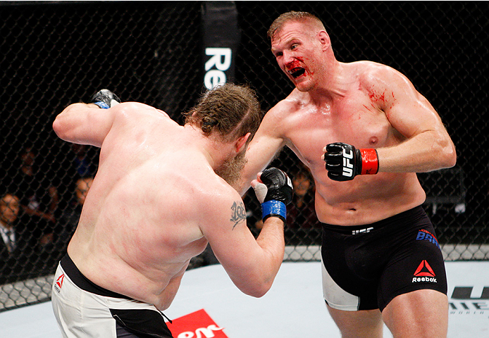 SAITAMA, JAPAN - SEPTEMBER 27: (From L to R) Roy Nelson of the United States of America and Josh Barnett of the United States of America exchange punches in their heavyweight bout during the UFC event at the Saitama Super Arena on September 27, 2015 in S