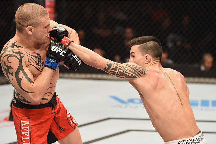 UBERLANDIA, BRAZIL - NOVEMBER 08: Thomas Almeida of Brazil punches Tim Gorman of the United States in their bantanweight bout during the UFC Fight Night at Sabiazinho Gymnasium on November 8, 2014 in Uberlandia, Brazil. (Photo by Buda Mendes/Zuffa LLC/