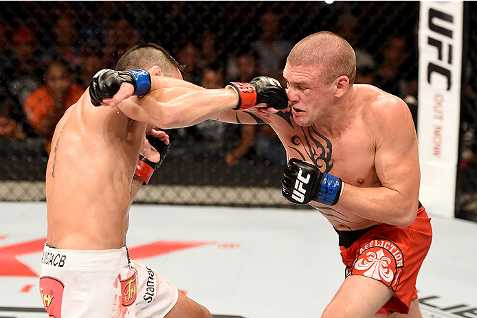 UBERLANDIA, BRAZIL - NOVEMBER 08: Thomas Almeida of Brazil punches Tim Gorman of the United States in their bantanweight bout during the UFC Fight Night at Sabiazinho Gymnasium on November 8, 2014 in Uberlandia, Brazil. (Photo by Buda Mendes/Zuffa LLC/