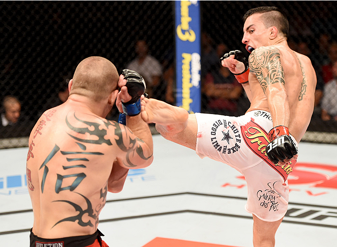 UBERLANDIA, BRAZIL - NOVEMBER 08: Thomas Almeida of Brazil kicks Tim Gorman of the United States in their bantanweight bout during the UFC Fight Night at Sabiazinho Gymnasium on November 8, 2014 in Uberlandia, Brazil. (Photo by Buda Mendes/Zuffa LLC/Zu