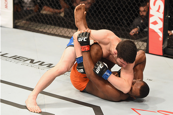 UBERLANDIA, BRAZIL - NOVEMBER 08: Leandro Silva of Brazil punches Charlie Brenneman of the United States in their lightweight bout during the UFC Fight Night at Sabiazinho Gymnasium on November 8, 2014 in Uberlandia, Brazil. (Photo by Buda Mendes/Zuffa