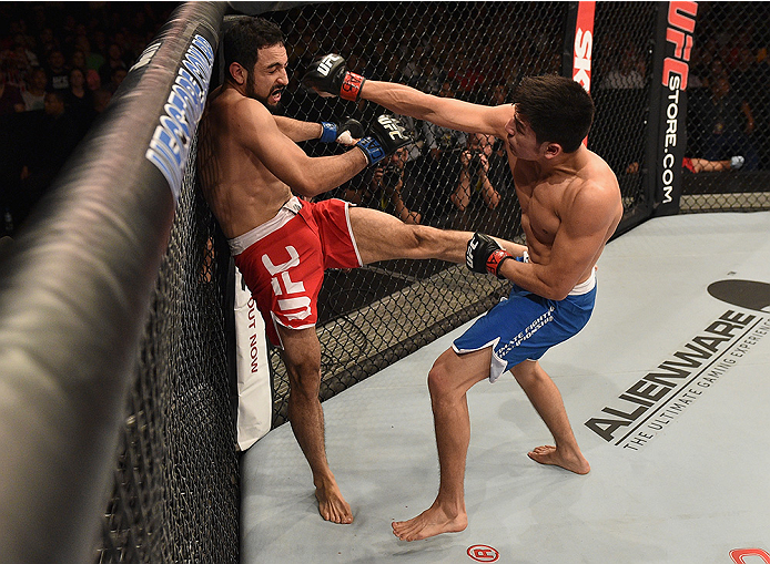 UBERLANDIA, BRAZIL - NOVEMBER 08: Diego Rivas of Chile punches Rodolfo Rubio of Mexico in their featherweight bout during the UFC Fight Night at Sabiazinho Gymnasium on November 8, 2014 in Uberlandia, Brazil. (Photo by Buda Mendes/Zuffa LLC/Zuffa LLC v