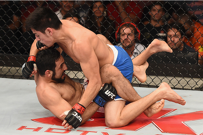 UBERLANDIA, BRAZIL - NOVEMBER 08: Diego Rivas of Chile punches Rodolfo Rubio of Mexico in their featherweight bout during the UFC Fight Night at Sabiazinho Gymnasium on November 8, 2014 in Uberlandia, Brazil. (Photo by Buda Mendes/Zuffa LLC/Zuffa LLC v