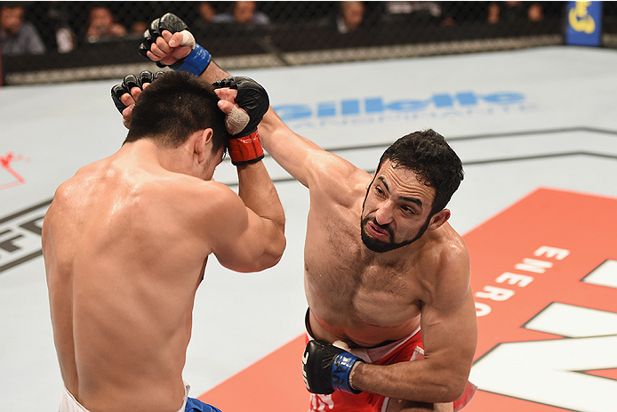 UBERLANDIA, BRAZIL - NOVEMBER 08: Rodolfo Rubio of Mexico punches Diego Rivas of Chile in their featherweight bout during the UFC Fight Night at Sabiazinho Gymnasium on November 8, 2014 in Uberlandia, Brazil. (Photo by Buda Mendes/Zuffa LLC/Zuffa LLC vi