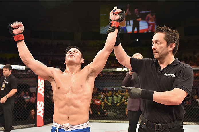 UBERLANDIA, BRAZIL - NOVEMBER 08: Diego Rivas of Chile celebrates his victory over Rodolfo Rubio of Mexico in their featherweight bout during the UFC Fight Night at Sabiazinho Gymnasium on November 8, 2014 in Uberlandia, Brazil. (Photo by Buda Mendes/Z