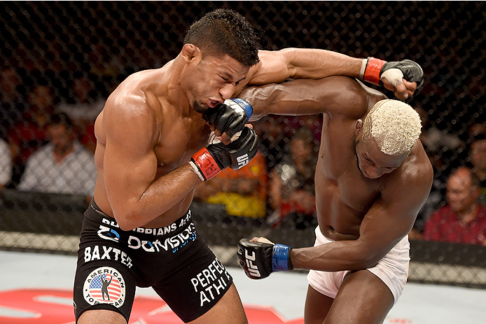 UBERLANDIA, BRAZIL - NOVEMBER 08: Dhiego Lima of Brazil punches Jorge de Oliveira of Brazil in their welterweight bout during the UFC Fight Night at Sabiazinho Gymnasium on November 8, 2014 in Uberlandia, Brazil. (Photo by Buda Mendes/Zuffa LLC/Zuffa LL