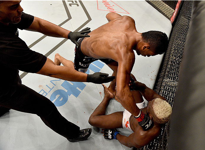 UBERLANDIA, BRAZIL - NOVEMBER 08: Dhiego Lima of Brazil punches Jorge de Oliveira of Brazil in their welterweight bout during the UFC Fight Night at Sabiazinho Gymnasium on November 8, 2014 in Uberlandia, Brazil. (Photo by Buda Mendes/Zuffa LLC/Zuffa LL