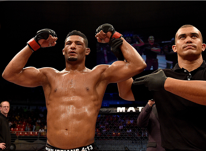 UBERLANDIA, BRAZIL - NOVEMBER 08: Dhiego Lima of Brazil celebrates after his victory over Jorge de Oliveira of Brazil in their welterweight bout during the UFC Fight Night at Sabiazinho Gymnasium on November 8, 2014 in Uberlandia, Brazil. (Photo by Buda