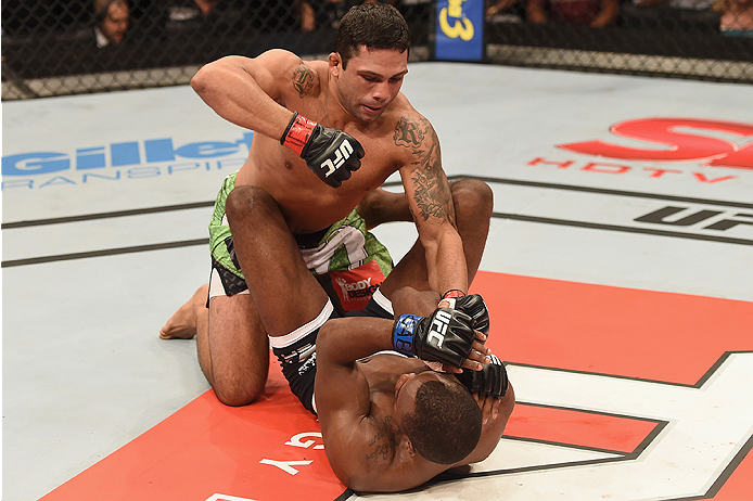 UBERLANDIA, BRAZIL - NOVEMBER 08: Claudio Silva of Brazil punches Leon Edwards of England in their welterweight bout during the UFC Fight Night at Sabiazinho Gymnasium on November 8, 2014 in Uberlandia, Brazil. (Photo by Buda Mendes/Zuffa LLC/Zuffa LLC