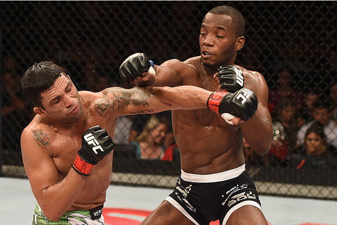 UBERLANDIA, BRAZIL - NOVEMBER 08: Claudio Silva of Brazil punches Leon Edwards of England in their welterweight bout during the UFC Fight Night at Sabiazinho Gymnasium on November 8, 2014 in Uberlandia, Brazil. (Photo by Buda Mendes/Zuffa LLC/Zuffa LLC