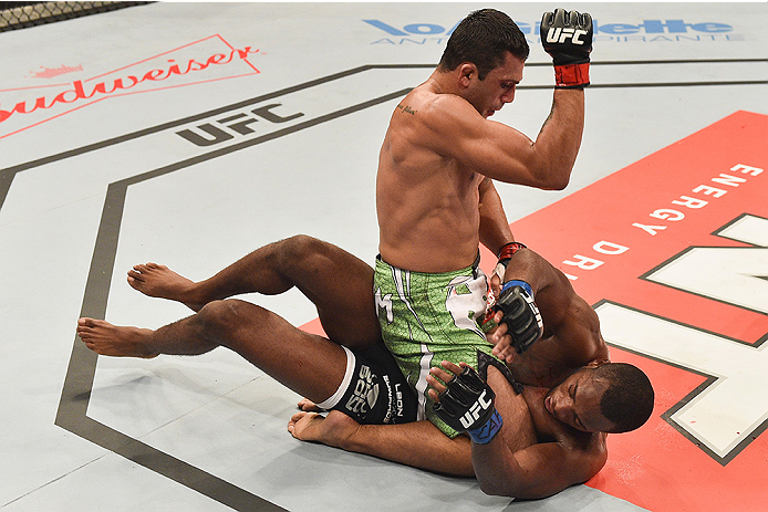 UBERLANDIA, BRAZIL - NOVEMBER 08: Claudio Silva of Brazil punches Leon Edwards of England in their welterweight bout during the UFC Fight Night at Sabiazinho Gymnasium on November 8, 2014 in Uberlandia, Brazil. (Photo by Buda Mendes/Zuffa LLC/Zuffa LLC