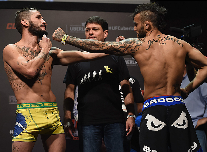 UBERLANDIA, BRAZIL - NOVEMBER 07: (L-R) Opponents Ian McCall and John Lineker face off during the UFC Fight Night weigh-in at Sabiazinho Gymnasium on November 7, 2014 in Uberlandia, Brazil. (Photo by Buda Mendes/Zuffa LLC/Zuffa LLC via Getty Images)