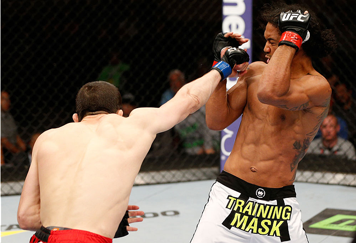 ALBUQUERQUE, NM - JUNE 07: (L-R) Rustam Khabilov punches Benson Henderson in their lightweight fight during the UFC Fight Night event at Tingley Coliseum on June 7, 2014 in Albuquerque, New Mexico. (Photo by Josh Hedges/Zuffa LLC/Zuffa LLC via Getty Ima