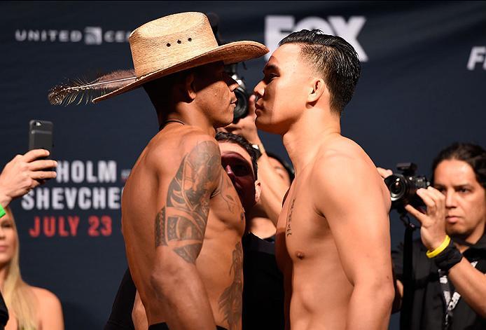 CHICAGO, IL - JULY 22: (L-R) Opponents Alex Oliveira of Brazil and James Moontasri face off during the UFC weigh-in at the United Center on July 22, 2016 in Chicago, Illinois. (Photo by Josh HedgesZuffa LLC/Zuffa LLC via Getty Images)