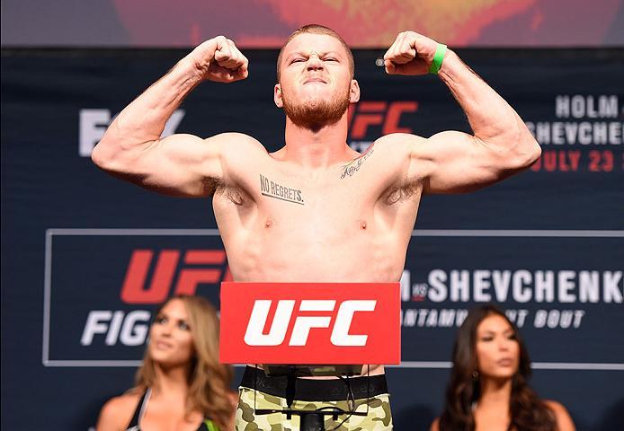 CHICAGO, IL - JULY 22: J.C. Cottrell poses on the scale during the UFC weigh-in at the United Center on July 22, 2016 in Chicago, Illinois. (Photo by Josh Hedges/Zuffa LLC/Zuffa LLC via Getty Images)