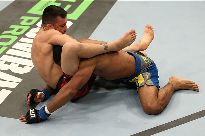 HALIFAX, NS - OCTOBER 4: (L-R) Pedro Munhoz of Brazil locks in a guillotine submission against Jerrod Sanders in their bantamweight bout at the Scotiabank Centre on October 4, 2014 in Halifax, Nova Scotia, Canada. (Photo by Nick Laham/Zuffa LLC/Zuffa LLC