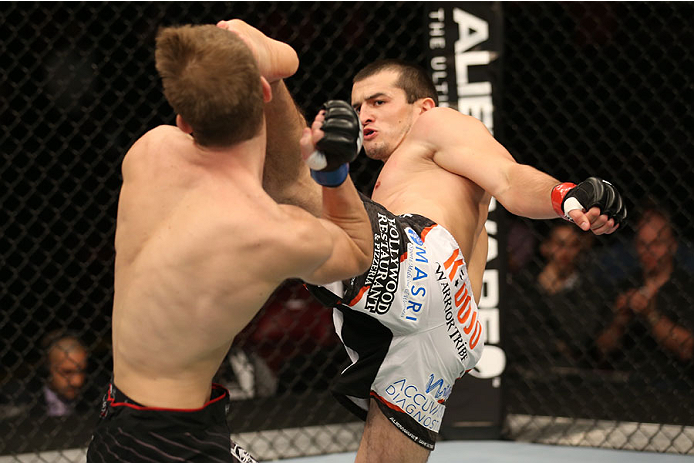 HALIFAX, NS - OCTOBER 4: (R-L) Albert Tumenov of Russia kicks Matt Dwyer of Canada in the head during their welterweight bout at the Scotiabank Centre on October 4, 2014 in Halifax, Nova Scotia, Canada. (Photo by Nick Laham/Zuffa LLC/Zuffa LLC via Getty