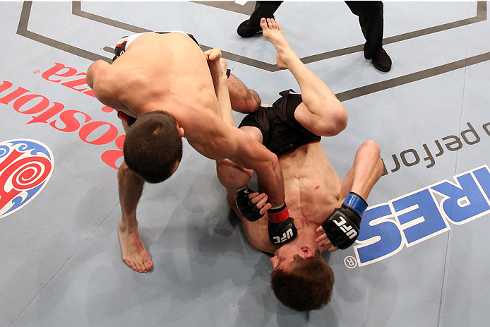 HALIFAX, NS - OCTOBER 4: (L-R) Albert Tumenov of Russia punches Matt Dwyer of Canada in the head during their welterweight bout at the Scotiabank Centre on October 4, 2014 in Halifax, Nova Scotia, Canada. (Photo by Nick Laham/Zuffa LLC/Zuffa LLC via Gett