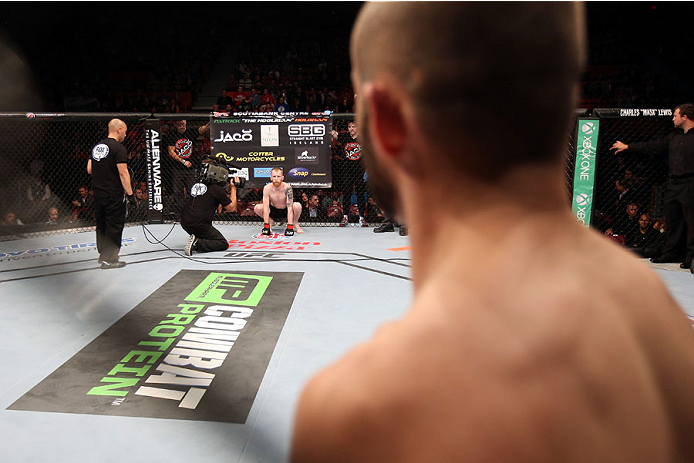 HALIFAX, NS - OCTOBER 4: (R-L) Chris Kelades of Canada looks across the Octagon at his opponent Patrick Holohan of Ireland before their flyweight bout at the Scotiabank Centre on October 4, 2014 in Halifax, Nova Scotia, Canada. (Photo by Nick Laham/Zuffa