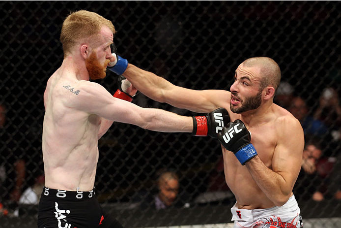 HALIFAX, NS - OCTOBER 4: (R-L) Chris Kelades of Canada punches Patrick Holohan of Ireland in their flyweight bout at the Scotiabank Centre on October 4, 2014 in Halifax, Nova Scotia, Canada. (Photo by Nick Laham/Zuffa LLC/Zuffa LLC via Getty Images)