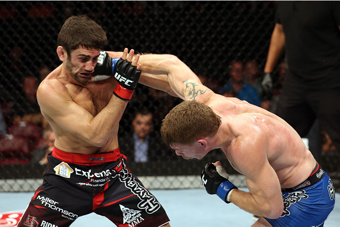 HALIFAX, NS - OCTOBER 4: (R-L) Paul Felder lands a punch to the face of Jason Saggo of Canada in their lightweight bout at the Scotiabank Centre on October 4, 2014 in Halifax, Nova Scotia, Canada. (Photo by Nick Laham/Zuffa LLC/Zuffa LLC via Getty Images