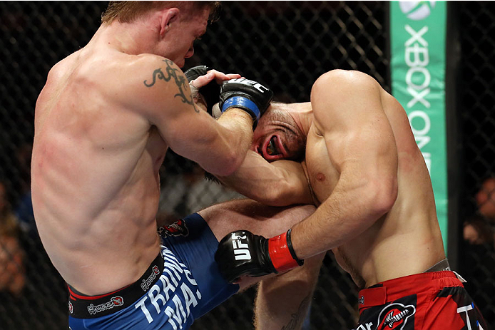 HALIFAX, NS - OCTOBER 4: (L-R) Paul Felder lands a knee to the body of Jason Saggo of Canada in their lightweight bout at the Scotiabank Centre on October 4, 2014 in Halifax, Nova Scotia, Canada. (Photo by Nick Laham/Zuffa LLC/Zuffa LLC via Getty Images)