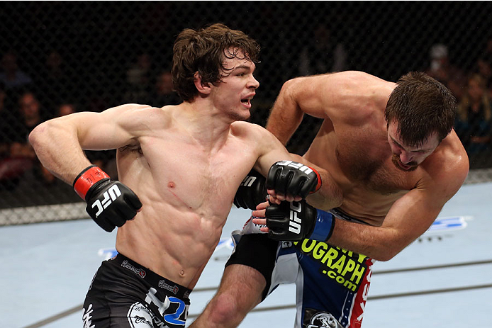HALIFAX, NS - OCTOBER 4: (L-R) Olivier Aubin-Mercier of Canada punches Jake Lindsey in their welterweight bout at the Scotiabank Centre on October 4, 2014 in Halifax, Nova Scotia, Canada. (Photo by Nick Laham/Zuffa LLC/Zuffa LLC via Getty Images)
