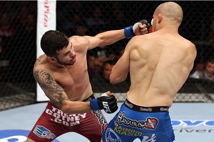 HALIFAX, NS - OCTOBER 4: (L-R) Roman Salazar punches Mitch Gagnon of Canada in their bantamweight bout at the Scotiabank Centre on October 4, 2014 in Halifax, Nova Scotia, Canada. (Photo by Nick Laham/Zuffa LLC/Zuffa LLC via Getty Images)