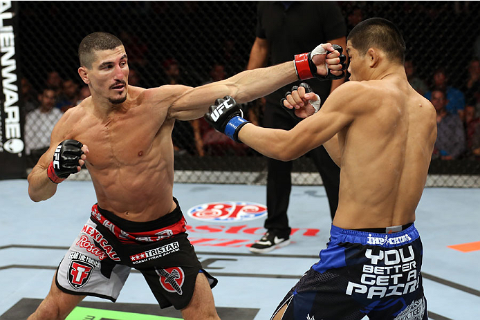 HALIFAX, NS - OCTOBER 4: (L-R) Nordine Taleb of Canada punches Li Jingliang of China in their welterweight bout at the Scotiabank Centre on October 4, 2014 in Halifax, Nova Scotia, Canada. (Photo by Nick Laham/Zuffa LLC/Zuffa LLC via Getty Images)