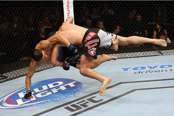 HALIFAX, NS - OCTOBER 4: (R-L) Nordine Taleb of Canada takes down Li Jingliang of China in their welterweight bout at the Scotiabank Centre on October 4, 2014 in Halifax, Nova Scotia, Canada. (Photo by Nick Laham/Zuffa LLC/Zuffa LLC via Getty Images)