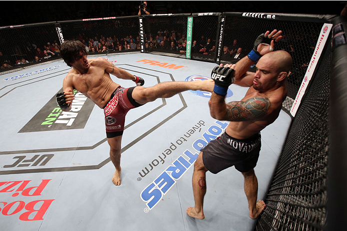 HALIFAX, NS - OCTOBER 4: (L-R) Elias Theodorou of Canada kicks Bruno Santos of Brazil in their middleweight bout at the Scotiabank Centre on October 4, 2014 in Halifax, Nova Scotia, Canada. (Photo by Nick Laham/Zuffa LLC/Zuffa LLC via Getty Images)