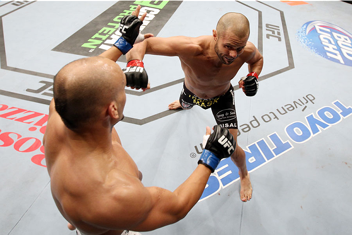 HALIFAX, NS - OCTOBER 4: (R-L) Chad Laprise of Canada punches Yosdenis Cedeno of Cuba in their lightweight bout at the Scotiabank Centre on October 4, 2014 in Halifax, Nova Scotia, Canada. (Photo by Nick Laham/Zuffa LLC/Zuffa LLC via Getty Images)