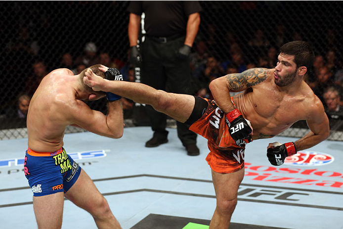HALIFAX, NS - OCTOBER 4: (R-L) Raphael Assuncao of Brazil kicks Bryan Caraway in their bantamweight bout at the Scotiabank Centre on October 4, 2014 in Halifax, Nova Scotia, Canada. (Photo by Nick Laham/Zuffa LLC/Zuffa LLC via Getty Images)