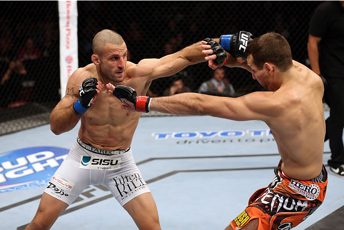 HALIFAX, NS - OCTOBER 4: (L-R) Tarec Saffiedine of Belgium punches Rory MacDonald of Canada in their welterweight bout at the Scotiabank Centre on October 4, 2014 in Halifax, Nova Scotia, Canada. (Photo by Nick Laham/Zuffa LLC/Zuffa LLC via Getty Images)
