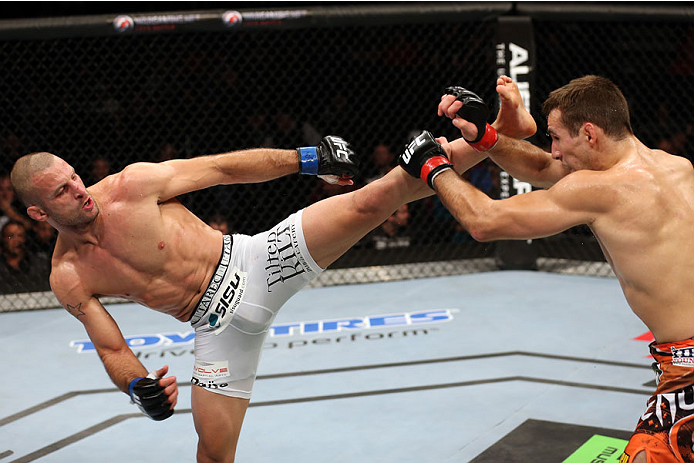 HALIFAX, NS - OCTOBER 4: (L-R) Tarec Saffiedine of Belgium kicks Rory MacDonald of Canada in their welterweight bout at the Scotiabank Centre on October 4, 2014 in Halifax, Nova Scotia, Canada. (Photo by Nick Laham/Zuffa LLC/Zuffa LLC via Getty Images)