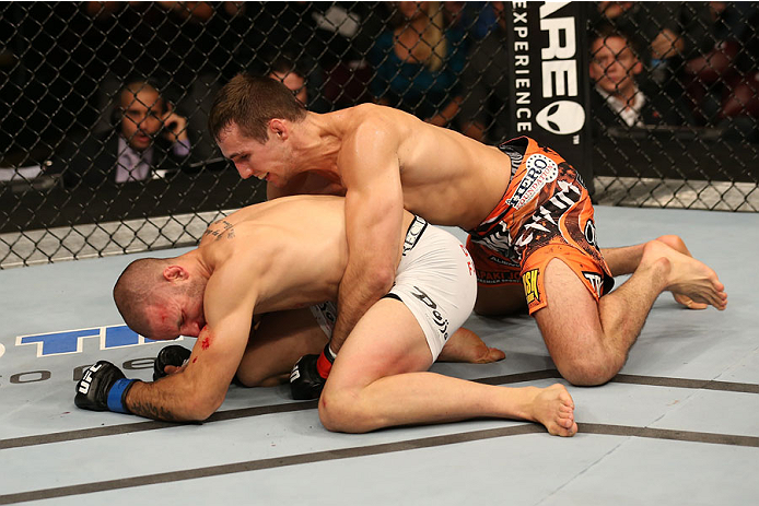 HALIFAX, NS - OCTOBER 4: (R-L) Rory MacDonald of Canada punches Tarec Saffiedine of Belgium in their welterweight bout at the Scotiabank Centre on October 4, 2014 in Halifax, Nova Scotia, Canada. (Photo by Nick Laham/Zuffa LLC/Zuffa LLC via Getty Images)
