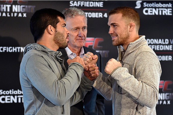 HALIFAX, NS - OCTOBER 2: (L-R) Raphael Assuncao and Bryan Caraway face off during the UFC Fight Night Ultimate Media Day on October 2, 2014 in Halifax, Nova Scotia, Canada. (Photo by Jeff Bottari/Zuffa LLC/Zuffa LLC via Getty Images)